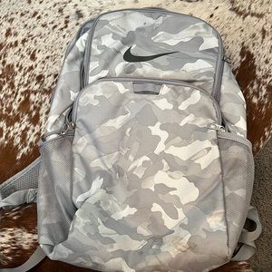 Nike camo backpack with multiple pocketed zippers